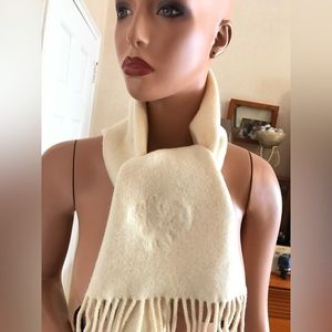 Versace off white scarf with Medusa logo and label. With minor defect.